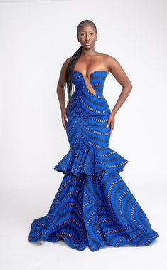 This Yetunde Corset African Print Mermaid Dress is a stunner! She's bold, beautiful and extremely gorgeous. Perfect for your occasions, birthdays, wedding, red carpet events, banquet, prom etc. This dress is 100% handmade, so you are welcome to request a customisation.  You are also welcome to request other fabric patterns. Handmade with 100% African wax cotton Care instructions: Hand wash with mild detergent. Do not bleach Zipper at the back Care Instructions Wash with Mild soap, do not bleach. Please see other beautiful African inspired clothes in our store https://www.etsy.com/uk/shop/Afrothrone Thanks for visiting our store. Gown Ankara, Ankara Maxi Dress, Royalty Dress, Dress African Print, Cotton Corset, Dress Ankara, African Wedding Dress, Dinner Dates, Dress African