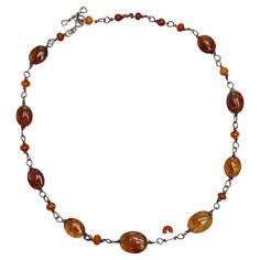 Wonderful silver necklace with floral etched amber beads, and a toggle clasp. There are no hallmarks, the necklace tests as silver. Measuring length 46.5cms / 18.3 inches. The largest beads are approximately 1.6cm / .63 inch by 1.2cm / .47 inch. One bead is damaged, a jeweller could move a top bead to replace the damaged one. The workmanship of this hand made necklace is of very high quality. This is a beautiful and unusual necklace, circa 1970s. Measuring Length, Beaded Chain Necklace, Unusual Necklace, Amber Necklace, Amber Beads, Toggle Clasp, Hand Forged, Beaded Chain, Etching