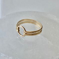 Two bands of heavy 14 gauge wire was hammered and forged to a 8mm gold filled circle. This double band ring is both delicate and bold. Select from gold band as shown, bright sterling silver, or mixed metal. Choose from sizes 4-10. Try stacking these with the other rings. View the rest of the ring collection below: http://www.etsy.com/shop/BellatrinaJewelry?section_id=11006644 ** Follow us for updates, contests, and promos. :) www.facebook.com/BellatrinaJewels www.twitter.com/BellatrinaJewel Adjustable Round Midi Rings In Recycled Gold, Adjustable Recycled Gold Midi Rings, Adjustable Hand Forged Gold Stackable Rings, Adjustable Hammered Gold Ring, Hammered Recycled Gold Stackable Rings, Adjustable Gold Hammered Ring, Hammered Stackable Rings In Recycled Gold, Hammered 14k Gold Midi Rings, Hammered 14k Gold Round Midi Rings