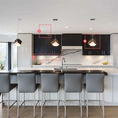 a kitchen with black cabinets and white countertops has red dots indicating the location of lights