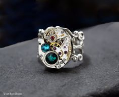 "SALE Personalized Steampunk Ring in Silver - - you can choose one color or 2 colors from the Swarovski crystal color chart in the last photo. For example, choose the birthstones of your children, you and your significant other, favorite color(s), wedding color(s), remembrance color(s), match outfit(s), your siblings birthstones for Mom, etc. I can add additional crystals. Be creative! Also available in Antiqued Brass ring. Questions? Send me a message, and I'll be happy to help. ~ Due to the vi Silver Jewelry With Custom Hardware Gift, Silver Jewelry With Custom Hardware As Gift, Steampunk Ring, Watch Ring, Steampunk Rings, Crystal Colors, Steampunk Watch, Steam Punk Jewelry, Punk Jewelry