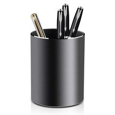 a pen holder with pens and pencils in it