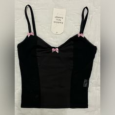 Unbranded Mesh Bustier Corset Top Color: Black With Pink Bows Size: S Please See Photos For Measurements And Material. New With Tags!! Questions? Please Leave A Comment Below! I Love Offers! Don’t Be Shy! Make An Offer! New To Poshmark? Want $10 Off Your First Poshmark Purchase? Join Me Now On My Favorite App By Creating A New Account!! For A Limited Time, Use My Code Freedomfairy To Save $10 On Your First Purchase: Https:// Posh.Mk/Poibgdktmgb $10 Off Your First Poshmark Purchase! I Love Offers Y2k Black Top With Built-in Bra, Y2k Fitted Camisole With Built-in Bra, Fitted Y2k Camisole With Built-in Bra, Fitted Y2k Camisole Crop Top, Y2k Fitted Cami Crop Top, Y2k Black Cami Crop Top, Trendy Black Corset With Built-in Bra, Black Y2k Camisole Crop Top, Cotton Fitted Bra With Removable Pads