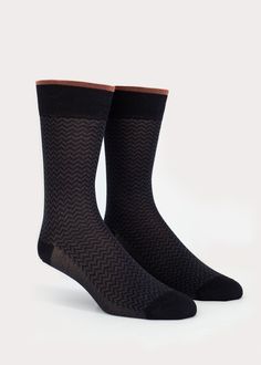 Luxe mid-calf high dress socks for men. Fabricated with the finest mercerized cotton. Our Parallels men's dress sock features a refined herringbone pattern and a pop-of colour cuff. Go ahead and show more sock! Details: Size Guide One size fits most.Recommended Men's US shoe size 7 - 12, Euro 39 - 45. Materials 65% Cotton, 34% Nylon, 1% SpandexMade in China Care Instructions Machine wash on perm press, no chlorine bleach,hang dry recommended. Black Business Socks For Winter, Modern Fitted Black Socks, Classic Formal Socks For Winter, Classic Winter Socks For Formal Occasions, Classic Winter Formal Socks, Fitted Black Business Socks, Formal Black Winter Socks, Black Formal Winter Socks, Elegant Formal Winter Socks