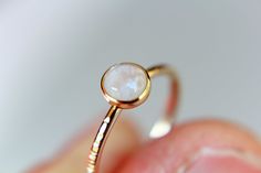 "This flash rainbow moonstone ring has a subtle, lux feel to it. I have set this 5mm round smooth rainbow moonstone gemstone into a solid 14kt yellow bezel cup with a thicker band ring. The 16 gauge solid 14kt yellow band has been also highly polished for a very reflective shine. This listing is for 1, 5mm rainbow moonstone ring. Material Information: Clarity: Occlusioned Color: rainbow Gemstone: moonstone Metal: 14kt yellow gold Handcrafted band: 16 gauge (1.4mm) faceted Please contact me with Ring Ding Dong, Gold Moonstone Ring, I Love Gold, Gemstone Stacking Ring, Ring Moonstone, Rainbow Rings, Rainbow Gemstones, Moonstone Engagement Ring, Ding Dong