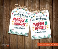 two merry and bright christmas tags hanging from strings