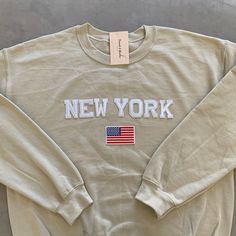 This very comfy and trendy New York sweatshirt is perfect for lounging in this cozy fall and winter season! This is also perfect for gifting to your loved ones! Please note that the letters are patches and are heat pressed, NOT embroidered. Purchasing this means you are aware and accept that. Our sweatshirts run in a UNISEX fit. The sweaters naturally have a slightly oversized fit giving extra room for moving around and comfort! For this reason, we highly recommend getting your true normal size Super Soft Crew Neck Casual Sweater, Super Soft Casual Crew Neck Sweater, Super Soft Crew Neck Cotton Sweatshirt, Super Soft Cotton Crew Neck Sweatshirt, Comfy Crew Neck Sweatshirt With Letter Print, Trendy Crew Neck Cream Sweatshirt, Cream Letter Print Sweatshirt For Loungewear, Trendy Cream Sweatshirt For Loungewear, Cozy Crew Sweatshirt With Letter Print