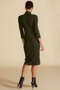 As functional as it is chic, this rib-knit midi dress has a fitted silhouette to contour your curves and 3/4 sleeves for arm coverage. Complement the versatile black shade with gold jewelry. DESIGN- Slim fit. Size up for a more relaxed look.- A mock neck, body-con style featuring 3/4 sleeves, asymmetrical button detail, and a midi length.- Silver shank buttons- Length: 42 1/2" FABRIC & CARE- Made from our signature Paris Rib, a stretchy-soft fabric. - 96% LENZING™ Modal, 4% Spandex- Non-toxic d Chic Solid Color Half Sleeve Midi Dress, Chic Stretch Midi Dress With Half Sleeves, Chic Solid Midi Dress With 3/4 Sleeves, Chic Solid Color Midi Dress With 3/4 Sleeves, Elegant Fall Half Sleeve Midi Dress, Elegant Half Sleeve Midi Dress For Fall, Elegant Solid Color Half Sleeve Midi Dress, Elegant Solid Color 3/4 Length Dress, Chic Bodycon Dress With 3/4 Sleeves