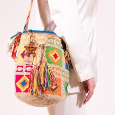 Introducing the exquisite Clara Medium Bag in a soft and chic Medium shade. Handcrafted by skilled Colombian artisans over weeks, this eye-catching bag combines traditional weaving techniques with modern style. Elevate your everyday look with this unique piece that is as functional as it is fashionable. 100% Natural Cotton Thread  Hand wash Luxury Multicolor Bucket Bag With Removable Pouch, Bohemian Top Handle Bucket Bag, Luxury Woven Bucket Bag For Travel, Luxury Multicolor Bag With Adjustable Strap, Luxury Multicolor Rectangular Bucket Bag, Luxury Natural Bag For Market, Luxury Natural Color Bag For Market, Multicolor Top Handle Crochet Bag For Travel, Luxury Woven Rectangular Bucket Bag