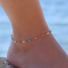 This beaded chain anklet is for women. Its boho style makes it a great piece of beaded summer jewelry. The ankle bracelet has an extension so the size can be adjusted. Adjustable Beaded Chain Anklets For Summer, Summer Gift Anklets With Gold Beads, Festival Anklets With Beaded Chain, Festival Anklets With Beaded Round Beads Chain, Colorful Beads Anklet For Festival, Bohemian Beaded Strand Anklets, Gold Anklets With Round Beads For Beach, Bohemian Beaded Anklets For Beach, Bohemian Strand Anklets With Tiny Beads