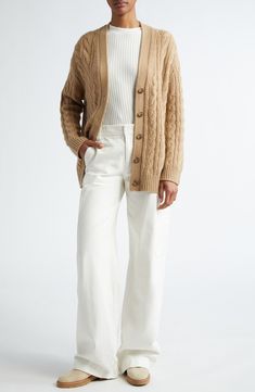 Luxe cashmere is blended with wool in a long, twisted-cable cardigan with slouchy dropped shoulders. 26" length (size Medium) V-neck Long sleeves 90% wool, 10% cashmere Dry clean or hand wash, dry flat Imported Cable Knit Merino Wool Cardigan, Cream Cable Knit Cardigan For Work, Classic Cable Knit Sweater Coat For Fall, Classic Fall Cable Knit Sweater Coat, Oversized Cable Knit Cardigan For Work, Workwear Cable Knit Cardigan, Fall Cable Knit Cashmere Cardigan, Cozy Cable Knit Sweater Coat For Work, Cable Knit Cardigan For Workwear