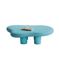 a small blue table with a book on it's top and a lighter in the middle