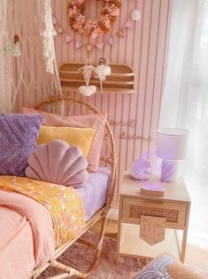 a bedroom with pink and purple decor on the walls, a wicker bed frame