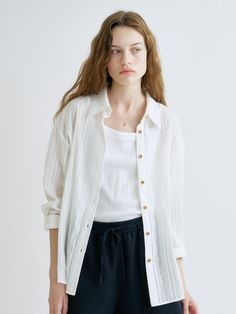 This is a trendy and feminine shirt by ANEDIT that is made out of high quality and sturdy material. With distinctive mood of the design and modern feminine look, you can style it for your comfortable daily outfit.- Feminine mood and soft touch- Bio processed cotton fabric- Relaxed loose silhouette White Long Sleeve Effortless Top, Effortless White Long Sleeve Top, Versatile White Shirt For Spring, White Effortless Shirt For Spring, Versatile White Blouse With Shirttail Hem, Effortless White Shirt For Spring, Effortless White Spring Shirt, Versatile White Button-up Blouse, Relaxed White Button-up Top