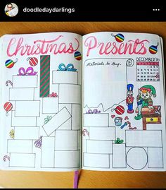 an open christmas planner is shown on a wooden table with a pen and pencil in it