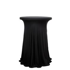 a round table with a black cloth on it