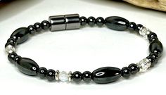 **Please Make Sure to Measure Your Wrist Before Ordering for the Perfect Fit** Our Hematite Magnetic Therapy Bracelet is a powerful and effective way to promote body health and wellness. Made with high quality AAA grade magnetic hematite beads, this bracelet is designed to provide strength and durability. Our bracelets are strung together on 90lb extra strength copolymer craft line and feature high strength magnetic clasps for easy wearing. We understand that sizing is crucial when it comes to m Magnetic Therapy Bracelets, Sewing Tape Measure, Magnetic Therapy, Hematite Beads, Bracelet For Men, Magnetic Bracelet, Clear Crystals, Body Health, Clear Crystal