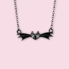 ✨Pumpkin King✨ A Nightmare before Christmas inspired Bat necklace. Is the Pumpkin King one of your Favorite Spooky Character? Show it off by adding this Bat bow tie Necklace to your collection. This Necklace is made of Sterling Silver with Gold, Rose Gold, Rhodium or, Black Rhodium Plated. It is 16in with an attached 2in extension to be 18in. Recommended Care and Cleaning: Do not wear in pool or shower. Do Not wear to sleep. Clean with polishing cloth ( Available on the web) . Wearing over time Adjustable Vampire Necklace For Halloween, Halloween Novelty Jewelry For Cosplay, Halloween Cosplay Novelty Jewelry, Adjustable Necklaces For Halloween Costume Party, Halloween Themed Black Necklace, Black Themed Necklace For Halloween, Themed Black Necklace For Halloween, Emo Halloween Party Necklaces, Emo Style Necklace For Halloween