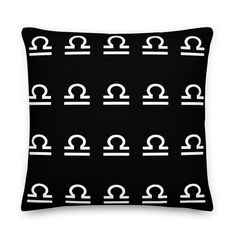 a black and white pillow with an arch pattern on it's side, in the middle