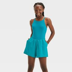 Why we're ALL IN: Sleeveless romper made with moisture-wicking, quick-drying fabric with spandex. The at-knee length romper comes with a built-in brief, a stash pocket, and has a pull-on style. Plus, the UPF 50+ rating helps keep skin shielded from UV rays. All in Motion™: Inspiring the potential in every body. Summer Sports Tank Top With Built-in Shorts, Solid Color Summer Gym Activewear, Solid Summer Activewear For Gym, Solid Activewear For Summer Gym, Blue Sleeveless Nylon Activewear, Sleeveless Summer Swimwear For Training, Breathable Sleeveless Swimwear For Summer, Summer Stretch Jumpsuits And Rompers For Gym, Summer Stretch Jumpsuit For Training