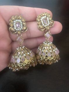 We are in love with these gorgeous new earrings, just added to our jhumka earrings collection! Glam up your formalwear in Noorzaracollection regal pieces! Beautiful jhumka earrings embellished with champagne and baby pink kundan stones In stock and ready to ship. Wedding Kundan Jhumkas Drop Earrings, Intricate Design Jhumkas For Wedding, Stone Work Jhumkas For Wedding, Wedding Drop Jhumkas With Latkans, Wedding Jhumkas With Latkans, Wedding Drop Jhumkas, Elegant Kundan Jhumkas For Eid, Wedding Chandbali Jhumkas With Matching Earrings, Stone Work Jhumkas For Wedding And Eid