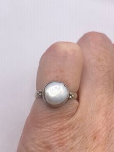 Vintage pearl pinky ring. 925 sterling silver  set with a huge white free form Pearl set in very detailed vintage filigree  Does not tarnish  Size 4 My jeweler can re size for a $20 fee All rings are shipped free in the US in a nice gift box.   Check out our over a THOUSAND great reviews Engraving is $4 per letter and is not always perfect depending on the piece. It can take a few days if the jeweler is busy. This is payable to Paypal Judithsltd@gmail.com Elegant Nickel-free White Rings, Elegant White Nickel-free Rings, Heirloom Pearl Jewelry For Gifts, Classic Hand Forged Oval Jewelry, Hand Forged Classic Oval Jewelry, Fine Jewelry Sterling Silver Pearl Ring With Oval Shape, Oval Sterling Silver Pearl Ring In Fine Jewelry Style, Fine Jewelry Oval Pearl Ring In Sterling Silver, White Pearl Drop Ring For Anniversary