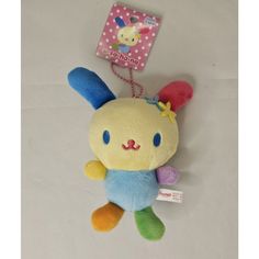 a stuffed animal with a tag attached to it