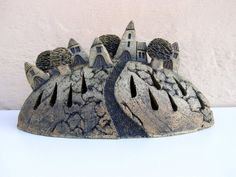 a statue of a castle on top of a rock