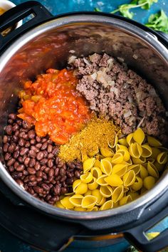 an image of food in the crock pot with noodles and sauces on it