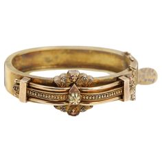 Old Victorian Bangle Bracelet Circa 1875 Total weight 29.30 grams 14k Yellow Gold Diameter from inside 2.25' inch( 57mm) Bangle width 12 mm Bangle Size for the Wrist is approx 6.5 (circumference 6.5' inch) Has a snap lock with extra chain security Beautifully made and preserved. The art detail work is very visibly hand made It does not have any stamp or mark but it is guaranteed 14k gold was checked by computer and assay test (#bjn 19330091)