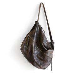 There are many loved bags in the R&T line, but the Hobo 'City Safari' is the one that we have sent all over the world, year after year. Always making incremental improvements. Making it lighter and adding new pocket and leather options. The easy Adjustable City Safari Hobo Pack in waxed canvas & leather easily adjusts from shoulder length to crossbody length and any length in between. A quick cinch of the strap, and the Hobo is a comfy backpack. Add the optional clip on grab handle/shoul Hobo Packs, Pale Tan, Leather Key Fobs, Convertible Bags, Silver Zipper, Backpack Straps, Waxed Canvas, Leather Key, Glasses Case