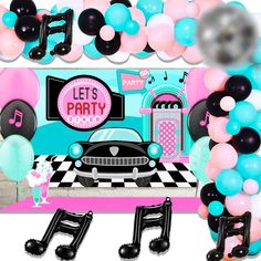 a party decoration with balloons, streamers and decorations for a car themed birthday or baby shower