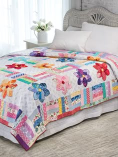 an image of a bed that has a quilt on it