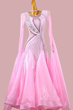 a pink ballroom dress with long sleeves and sequins