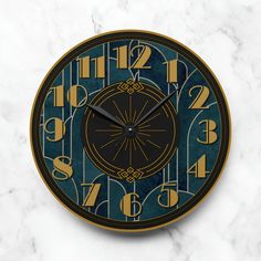 a clock that is on the side of a wall next to a marble table top