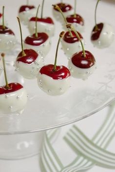 small cherries are arranged on a cake plate