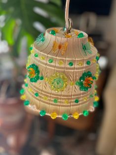 a decorative item hanging from a string on a table