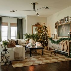 a living room filled with furniture and a christmas tree