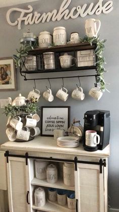 a white cabinet with coffee cups and mugs on it, hanging from the wall