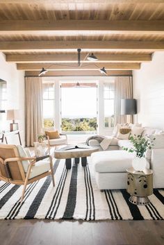 the living room is decorated in white and black