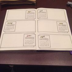 an open notebook with calendars on it