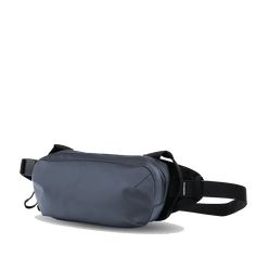 The WANDRD D1 Fanny Pack is a versatile bag that can be worn on your hip or cross-body style. With dedicated organization for things like your phone, keys, and wallet, and enough space to fit a small camera, this is one badass minimal carry solution. Features: Shoulder Carry Waist Carry Phone Pocket Fidlock Magnetic Buckle Dual Side Handles Small Camera Carry Cash/Passport Pocket Key Clip Weather Resistant YKK Zippers Internal Organization Specs: Dimensions: 5"H X 9"W X 2.5"D Volume: 2 L Weight: Sling Bag For Men, Hip Pack, Small Camera, Key Clip, Bagpack, Body Style, Men's Accessories, Sling Bag, Fanny Pack