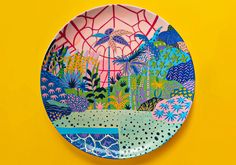 a colorful plate on a yellow background