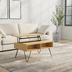 a living room scene with focus on the coffee table and white sofa in the background