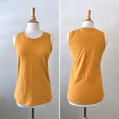 Basic cotton knit tank top.  This is a nice basic tank top that can be worn alone or layered. Length from shoulder to hem is about 25”  *Length can be adjusted for you as neededColor shown is Mustard Garments are Made To Order Please allow 7-10 days for your item to be sewnBelow are my standard size measurements, which are simply a guideline, if you would like to include your personal measurements in the notes to seller box during checkout, I will be sure to make you the best fit ~ if you have a Casual Fitted Sleeveless T-shirt, Fitted Sleeveless Cotton T-shirt, Basic Crew Neck Tank Top, Stretch Sleeveless Solid T-shirt, Solid Stretch Sleeveless T-shirt, Casual Plain Tank Top For Summer, Basic Cotton Tank Top For Spring, Spring Basic Cotton Tank Top, Sleeveless Relaxed Fit Tops In Plain Color