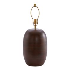 a brown vase with a light attached to it