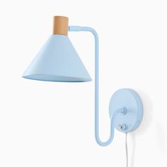 a light blue wall lamp with a wooden arm and white cord attached to the side