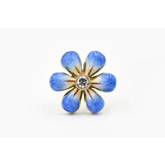 This pair of blue enamel daisy earrings are part of the daisy line, a beautiful handmade line of jewelry by Sandra J. Sensations. Each flower is hand painted by an enamel artist. The flowers are 14k with diamonds in the center. Each diamond is approximately .07 carats so the total diamond weight is .14 carats atw. Each flower in solid gold and has a post back.   They come in purple, yellow, pink and blue.  If we do not have it currently in stock it takes up to 8 weeks to order. Flower-shaped Enamel Ring For Gift, Flower-shaped Enamel Ring As Gift, Flower Shaped Enamel Ring For Gift, Floral Enamel Ring As Gift, Flower Shaped Enamel Ring As A Gift, Unique Enamel Flower Shaped Jewelry, Unique Enamel Flower Jewelry, Handmade Enamel Flower Jewelry, Handmade Enamel Flower Shaped Earrings