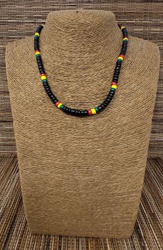 "Rasta Necklace. Wooden Necklace. Unique design with black color wooden beads. Handmade with rasta color wooden beads, black color wooden beads, strong durable cord and barrel clasp. Unisex Design. Necklaces is 18\" Inches Around the neck. Comfort fir Design FAST & FREE SHIPPING! *First Class Mail Visit my Etsy Shop to see more Designs! Handmade Rasta Wooden Earrings, Rasta Bracelets and Necklaces. Click here to see more designs: https://www.etsy.com/shop/FreedomLifeStyle" Black Wooden Beads Necklace For Festival, Black Wooden Beaded Necklaces For Festival, Adjustable Black Beaded Necklace With Wooden Beads, Adjustable Black Wooden Beaded Necklace, Black Wooden Beads Bohemian Style, Adjustable Black Jewelry With Wooden Beads, Black Bohemian Wooden Beads, Bohemian Black Wooden Beads, Black Large Beads For Festivals