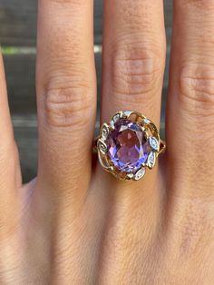 Total Weight: 5.2 grams Size: 6.75 Width: 1.8-4.4mm Amethyst: 12.3x9.7mm Diamonds: Under 1mm, very small Condition: In great condition showing little wear with no damage. All gold has been thoroughly checked with an Olympus XRF spectrometer. It is guaranteed 14k gold.  All our jewelry is properly washed and disinfected to ensure customers get clean items with every order.  Returns accepted but may be subjected to a restock fee.  Please message with any questions:) Elegant Lavender Amethyst Ring In 14k Gold, Oval Amethyst Ring Stamped 14k, Formal 14k Stamped Amethyst Ring, Formal Purple Birthstone Ring With Prong Setting, Fine Jewelry Purple Topaz Ring With Prong Setting, Purple Topaz Ring In Prong Setting, Purple Birthstone Ring In 14k Gold, Purple Topaz Ring With Prong Setting, Oval Purple Topaz Ring For Anniversary